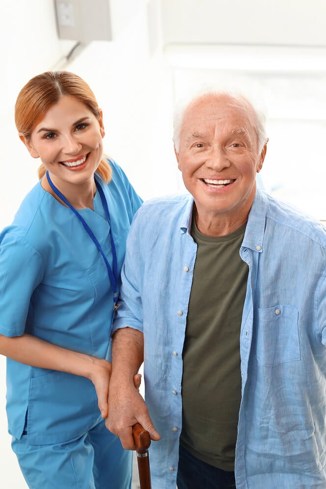 Nurse Comforting Elderly Woman at Nursing Home Colleyville