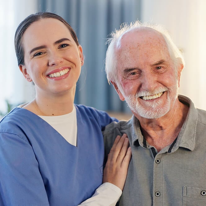 Caregiver Comforting Resident at Memory Care Facility